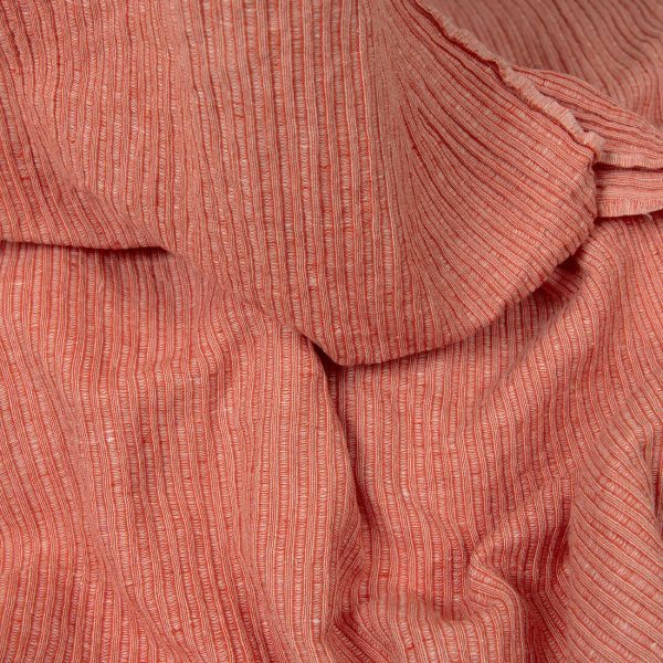 Washed linen cotton fabric in red-white stripes detail view