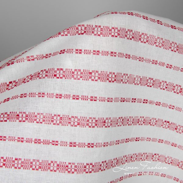 White linen-cotton fabric in red patterned stripes for sewing tablecloths, napkins, curtains, clothes