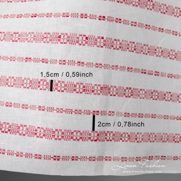 White linen-cotton fabric with horizontal red patterned stripes, woven in traditional folk geometric ornaments