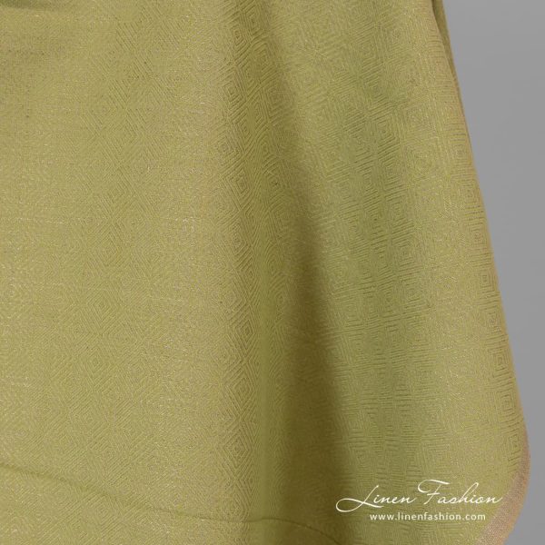 Diamond patterned green grey fabric.