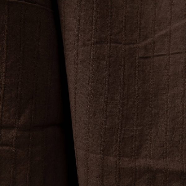 Dark brown washed linen cotton fabric close up detail