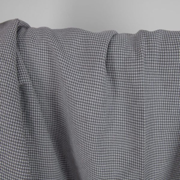 Washed linen cotton fabric grey houndstooth pattern close up detail