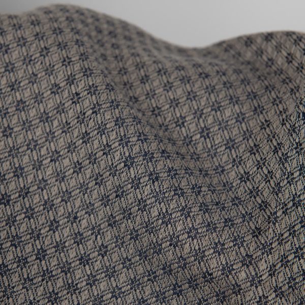 Linen cotton fabric blue and beige diamond pattern close up detail