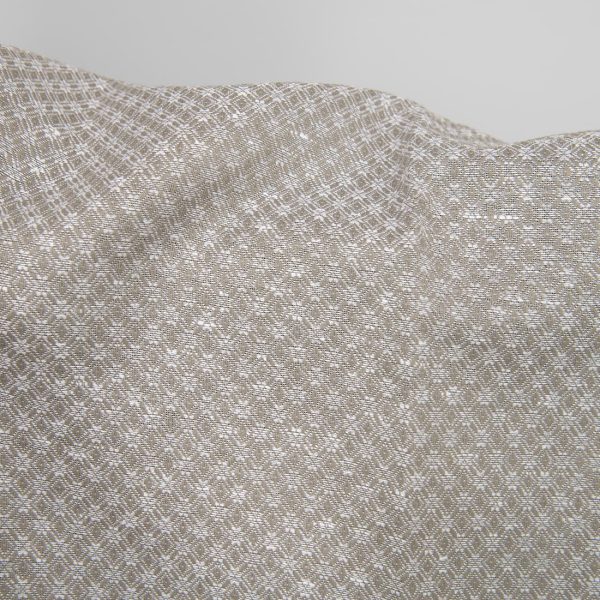 Linen cotton fabric dark beige and white diamonds close up detail