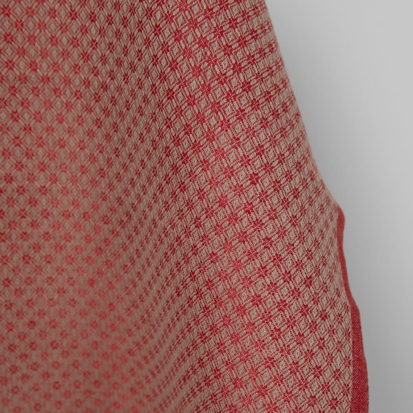 Linen cotton fabric red and beige diamond pattern close up detail