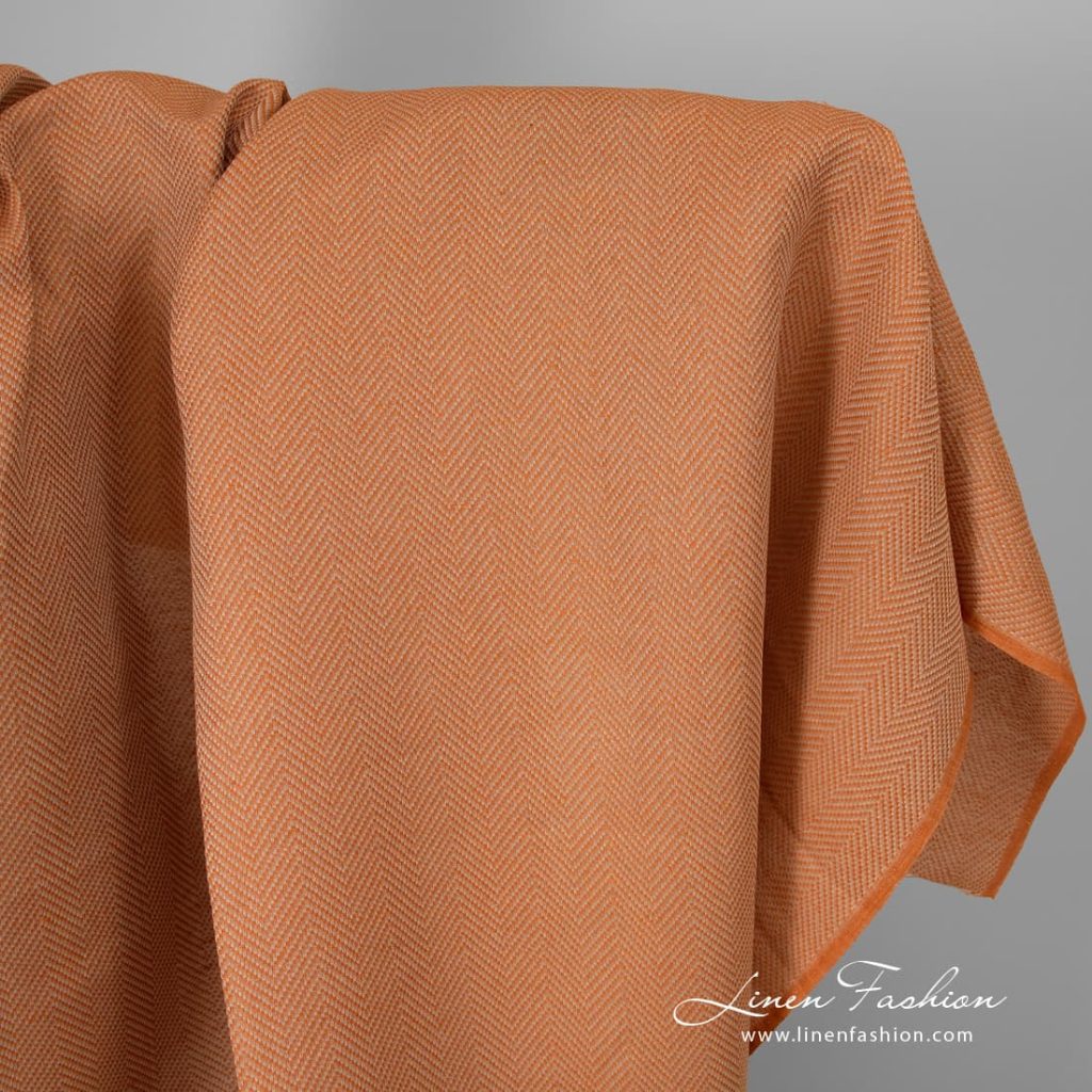 Orange linen cotton fabric in herringbone.