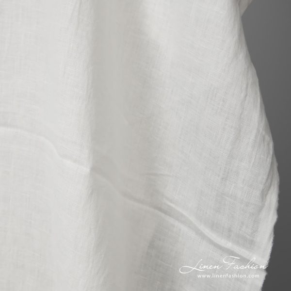 Lightweight washed linen fabric white colour close up view