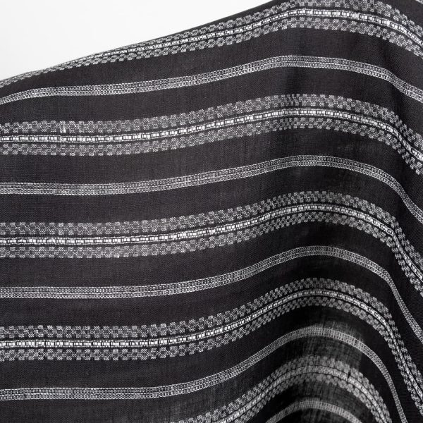 Linen fabric black with white patterned stripes close up detail