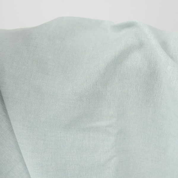 Wide linen cotton fabric pale turquoise colour close up view