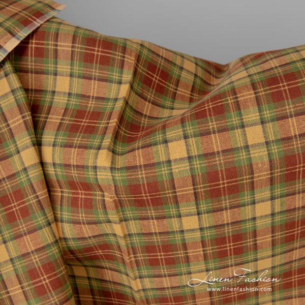 Linen cotton fabric in red, green and yellow checks suitable for playful design items (clothing, bedding, curtains, tablecloths, etc.).