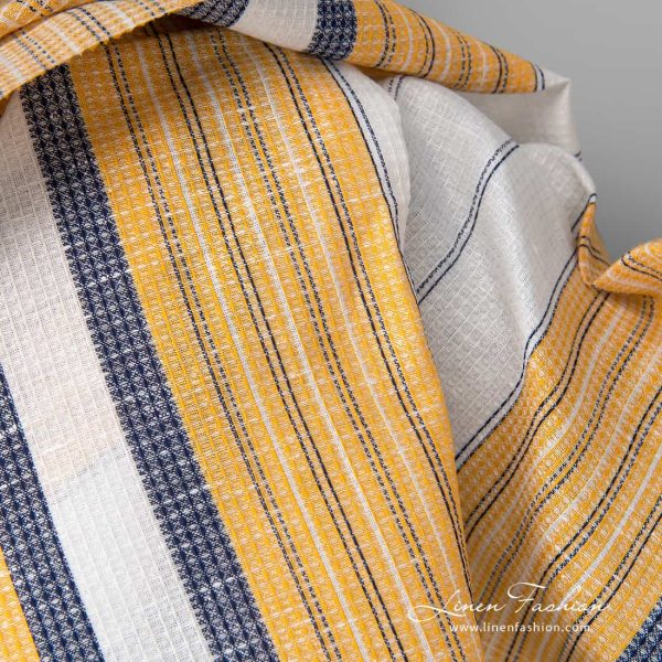 Linen cotton fabric white waffle with yellow blue stripes close up detail