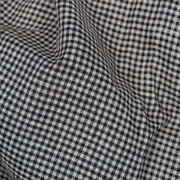Linen fabric in natural and black checks close up detail