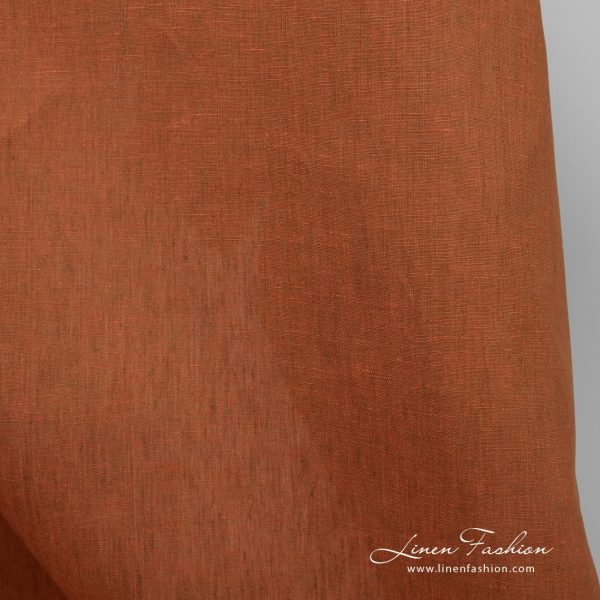 Orange wide linen fabric in plain weave pattern