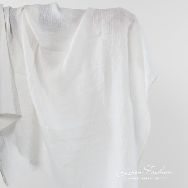 Off white linen fabric with checks.