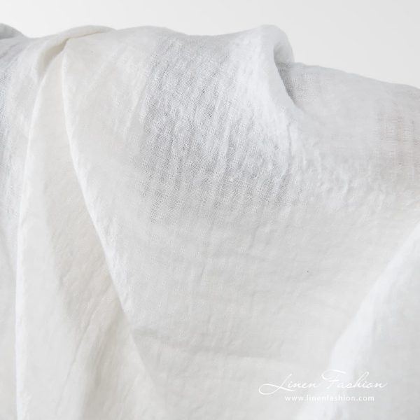 Washed 100% linen fabric in off white.