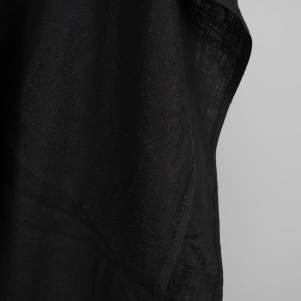 Black washed linen fabric in herringbone edge