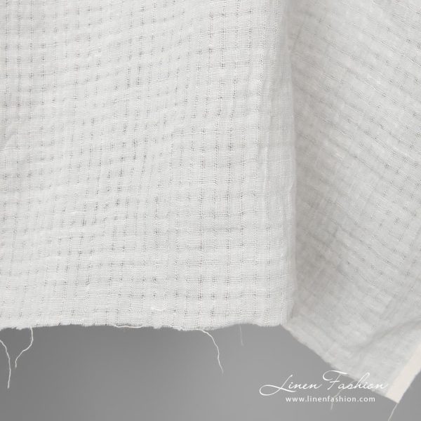 Light grey washed openwork linen fabric is perfect to sew the summer clothes and shawls
