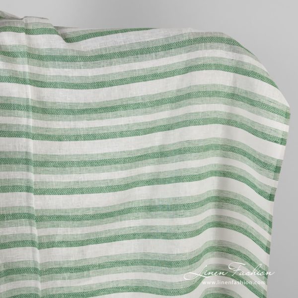 Linen fabric in green and white herringbone stripes