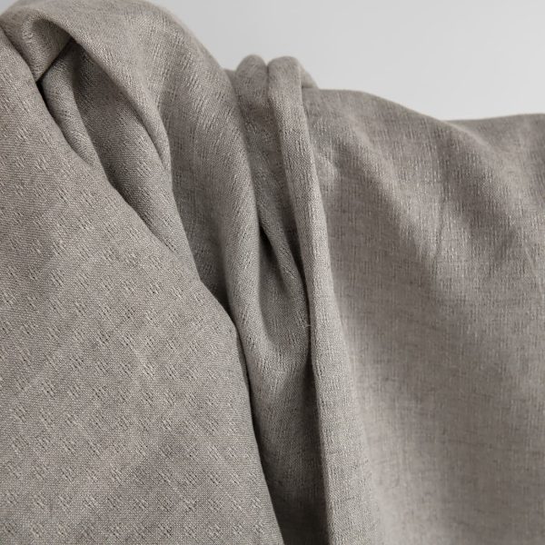 Natural linen fabric in an openwork pattern texture