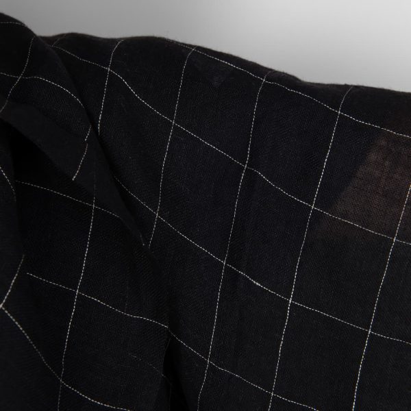 Black transparent checked linen fabric washed close up detail