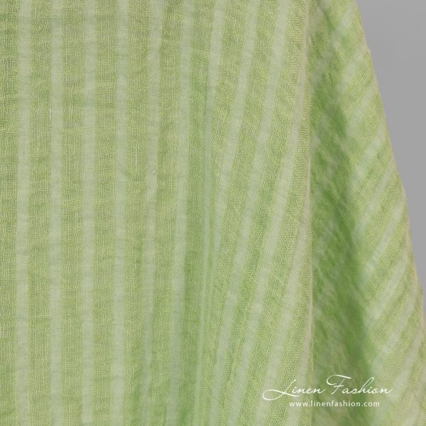 Washed 100% linen fabric in lime green stripes.