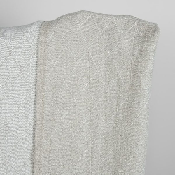 Grey double-sided washed linen fabric with a pattern darker side