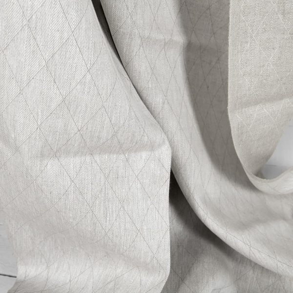 Beige double-sided linen fabric in a diamond pattern texture