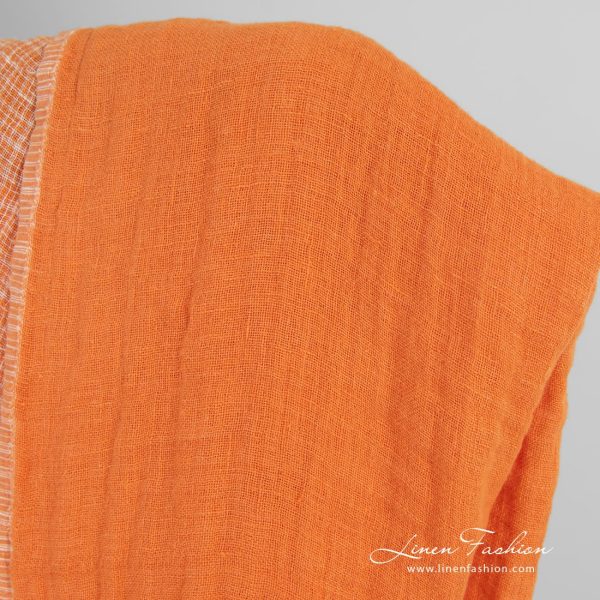 Double-sided orange linen fabric in checks, perfect for clothes and home textile
