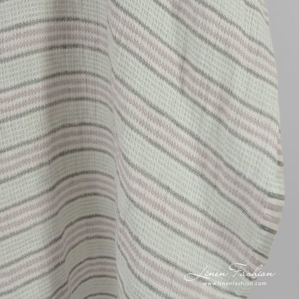 Green striped linen fabric in waffle pattern, specially washed to increase softness