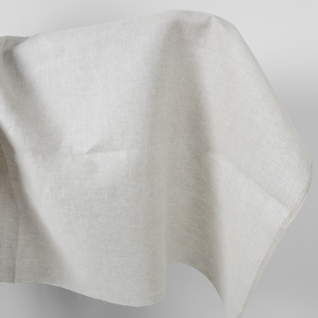 Linen fabric beige in herringbone pattern