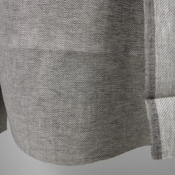 Linen fabric greyish brown in herringbone pattern edge