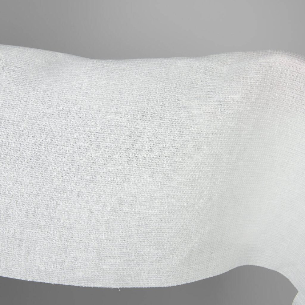 Off-white linen fabric in a small check pattern