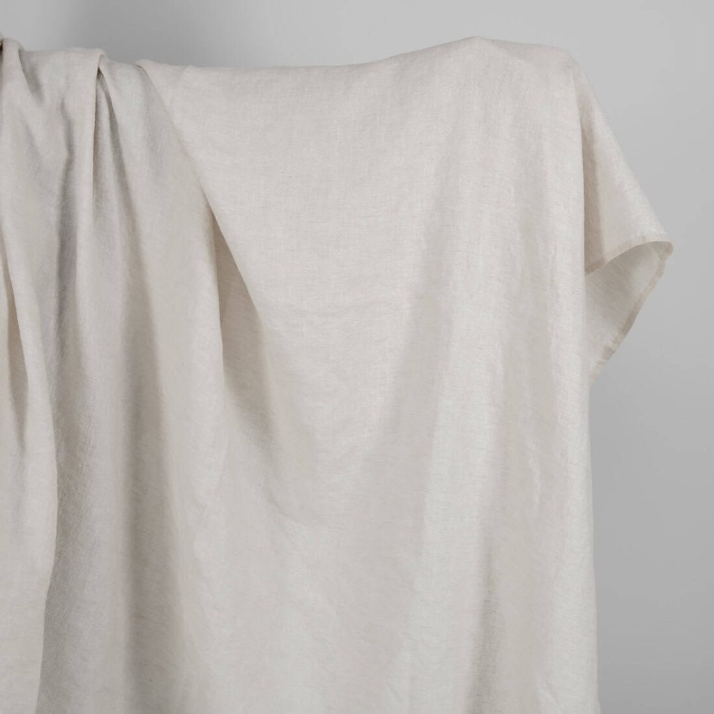 Washed linen wool fabric beige in herringbone pattern