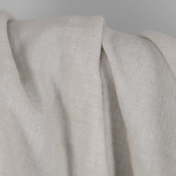 Washed linen wool fabric beige in herringbone pattern texture