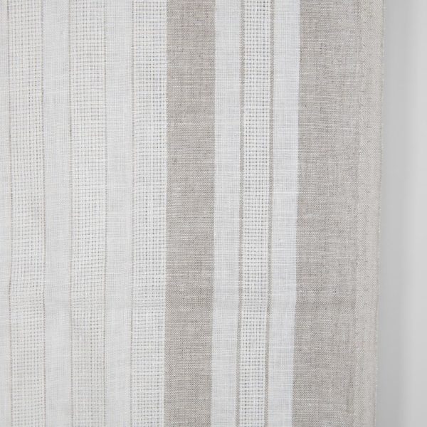 White linen fabric with undyed natural linen stripes close up photo