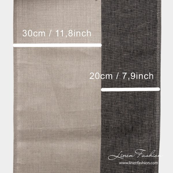 Natural and black stripe measures on narrow linen fabric