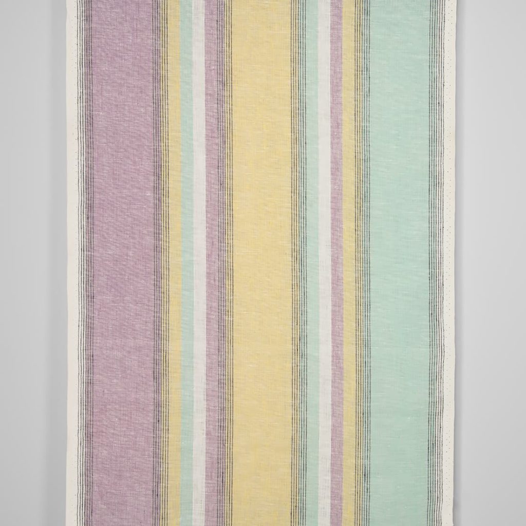 Narrow linen fabric in pastel multicolour stripes