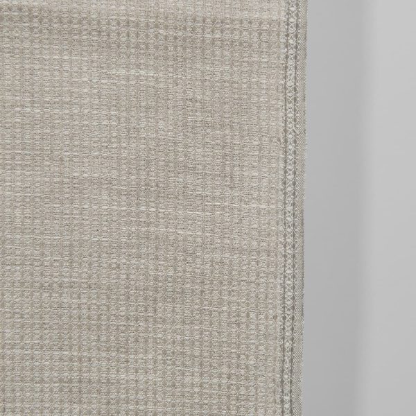 Narrow linen fabric natural and off-white waffle close up detail