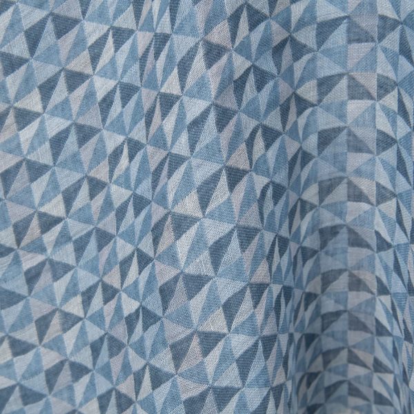 Washed linen fabric in blue triangles close up detail