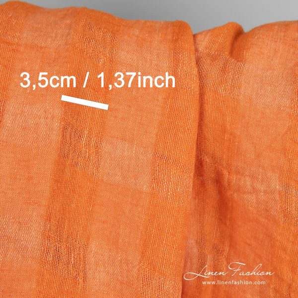 Linen fabric in transparent checks woven from orange and peach yarns
