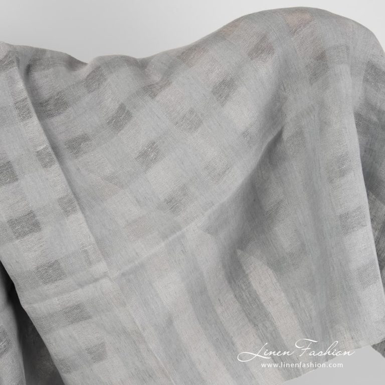 Grey linen fabric with sheer checks.