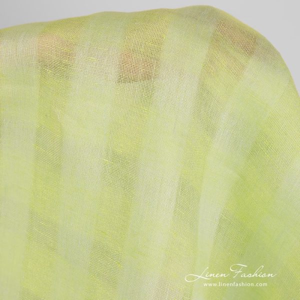 Checked linen fabric in light lime green colour.