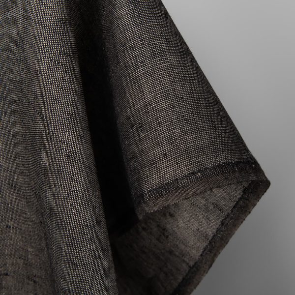 Linen fabric in natural and black pattern, fabric edge