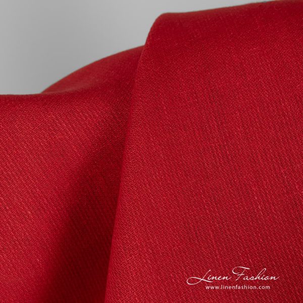 Patterned solid red linen fabric.