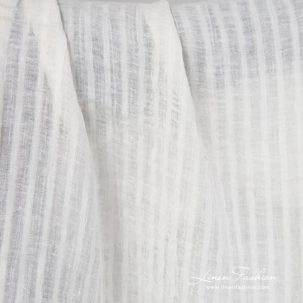 Off white linen fabric in stripes.