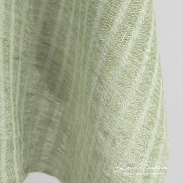 Green linen fabric in transparent vertical stripes