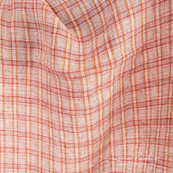 Orange linen fabric in checks, specially washed to increase softness