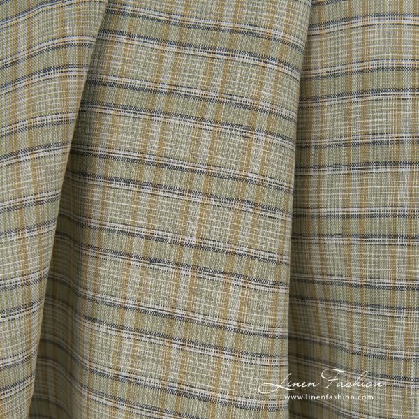 Green dyed 100% linen fabric in checks.