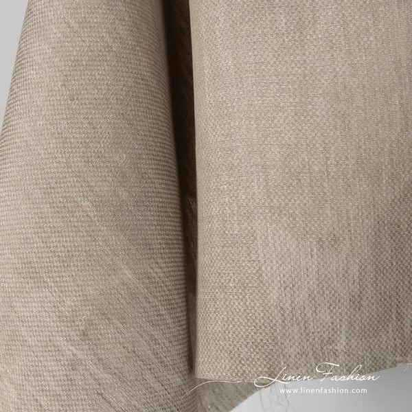 Beige coloured 100% linen fabric.
