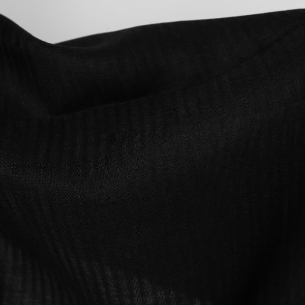 Sheer linen fabric in black stripes close up detail